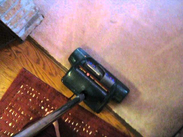 cleaning living room with Rainbow E2 Hoover Windtunnel Power Nozzle